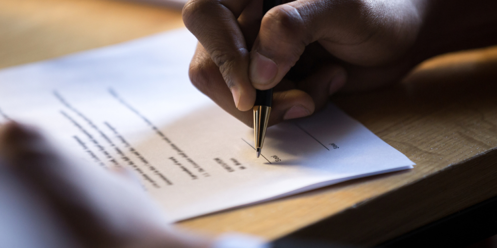 Person signing a form