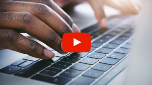 Hand typing on a keyboard