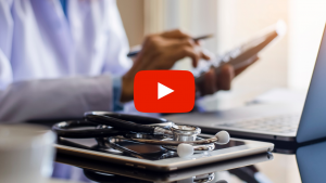 Doctor using a calculator