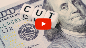 Money with the word "Cut" displayed