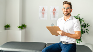 Chiropractor sitting on a table
