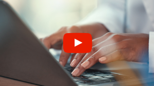 Person typing on keyboard