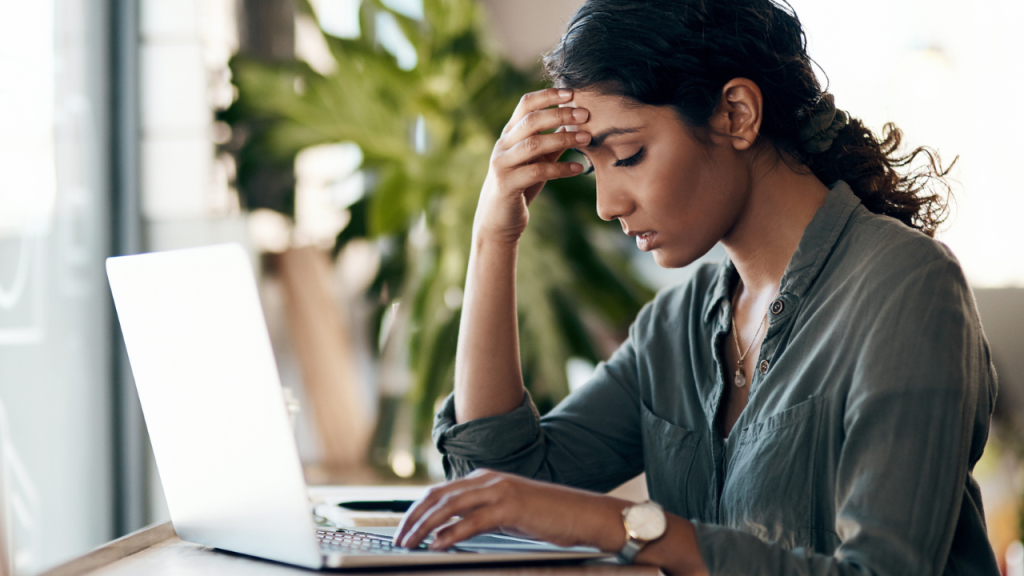 Stressed person using a computer