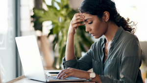 Stressed person using a computer