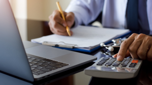 Doctor using a calculator