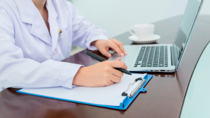 Doctor completing medical notes