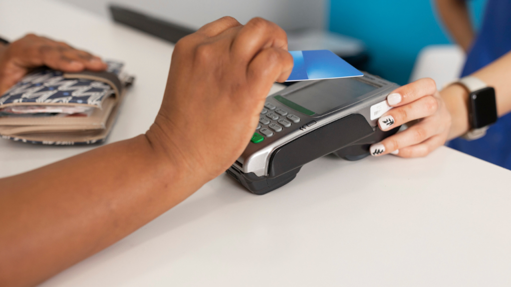 Person making a credit card payment