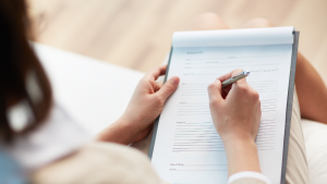 patient filling out medical forms