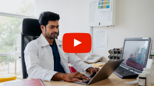 Doctor typing on a computer