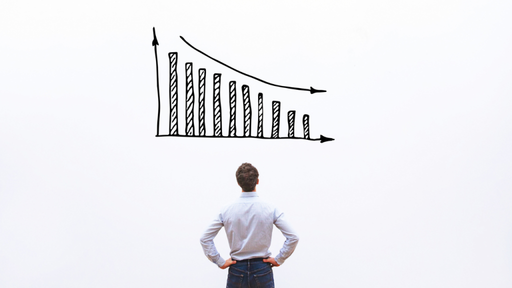 Person looking at a decreasing graph