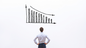 Person looking at a decreasing graph