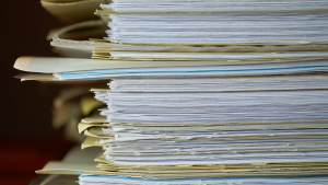 File folders stacked on a desk