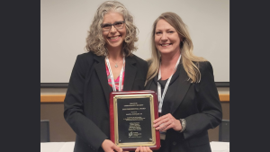 Dr. Mary Huffman receiving the ICS President's Award
