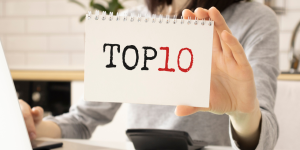 Person holding a top 10 sign