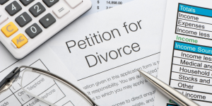 "Petition for Divorce" with calculator and financial documents