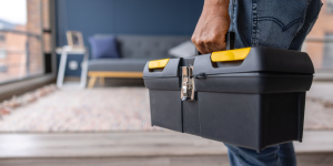 Person carrying a toolbox