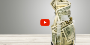 Jar of money sitting on a counter