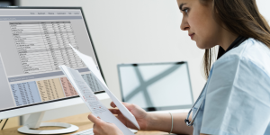 Medical professional reviewing medical invoices