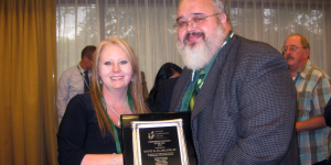 Dr. Scott Fladland receiving the Illinois Chiropractic Physician of the Year Award in 2013