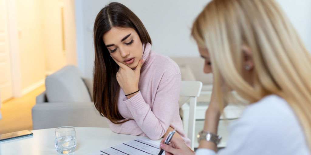 Doctor reviewing codes with staff member