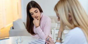 Doctor reviewing codes with staff member