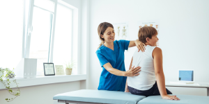 Chiropractic physician treating a minor