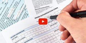 Person filling out a prior authorization form