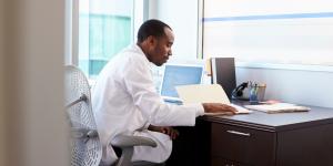 Doctor reviewing files