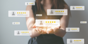 Person holding tesimonials and reviews