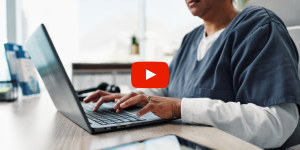 medical professional using a laptop