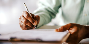 Person filling out a form