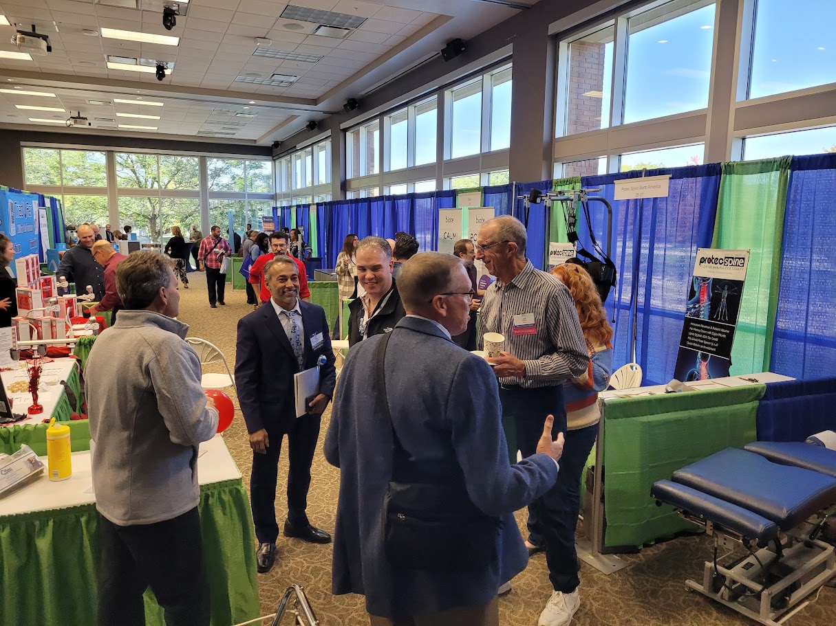 Chiropractic physicians networking at the ICS convention trade show