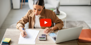 Person sitting at a desk working on calculations
