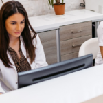 new associate chiropractor’s Medicare billing eligibility being checked at the front desk.