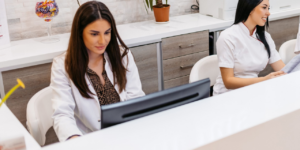 new associate chiropractor’s Medicare billing eligibility being checked at the front desk.