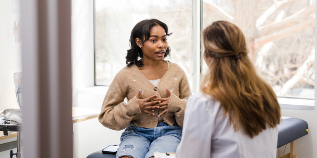 Physician talking to patient