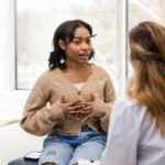 Physician talking to patient